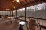 Main Floor Screen Proch with Rocking Chairs, Swing and a Picnic Table 